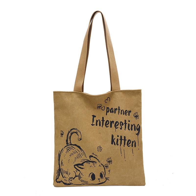 

Мультяшна сумка-тоут з канвасу з малюнком кота та літер жіноча 2025 осінь та зима нова великої місткості сумка на плече універсальна сумка-тоут