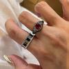 Retro diamond inlay ruby circular rings for women high-end light luxury fashion black and red ring couple style banquet