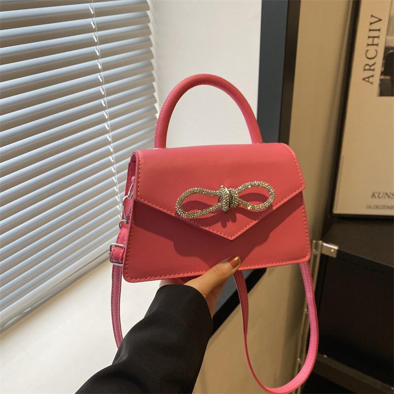 Simple and popular versatile solid color bow sewing line women's bag fashionable oblique span shoulder handbag