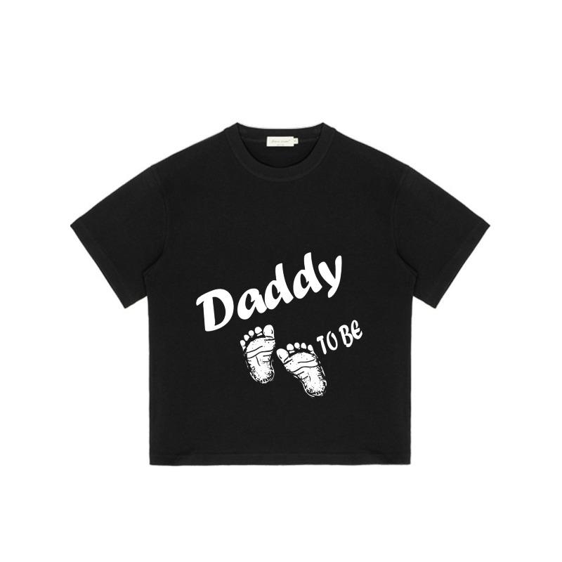 Daddy To Be T Shirt Black Baby Footprints and Text Graphic Design for Expecting Fathers Pregnancy Announcement Party Gift