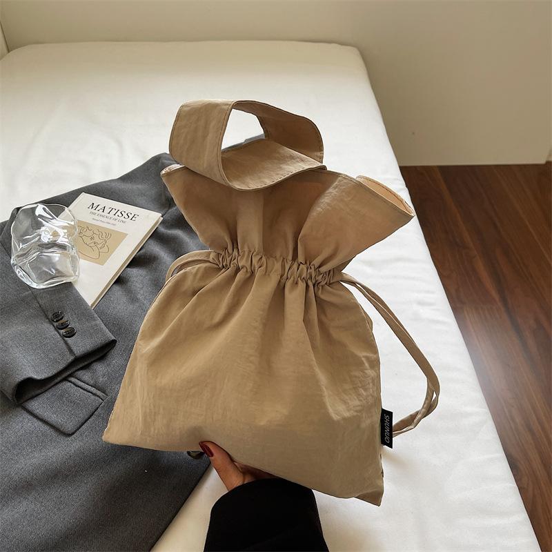 Korean version of girls bag large capacity ins style solid color personalized pleated canvas bag drawstring simple foreign style shoulder bag