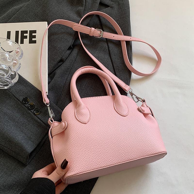 Spring and summer popular Korean version niche sweet lychee pattern portable shell bag fashionable simple style commuter versatile messenger bag