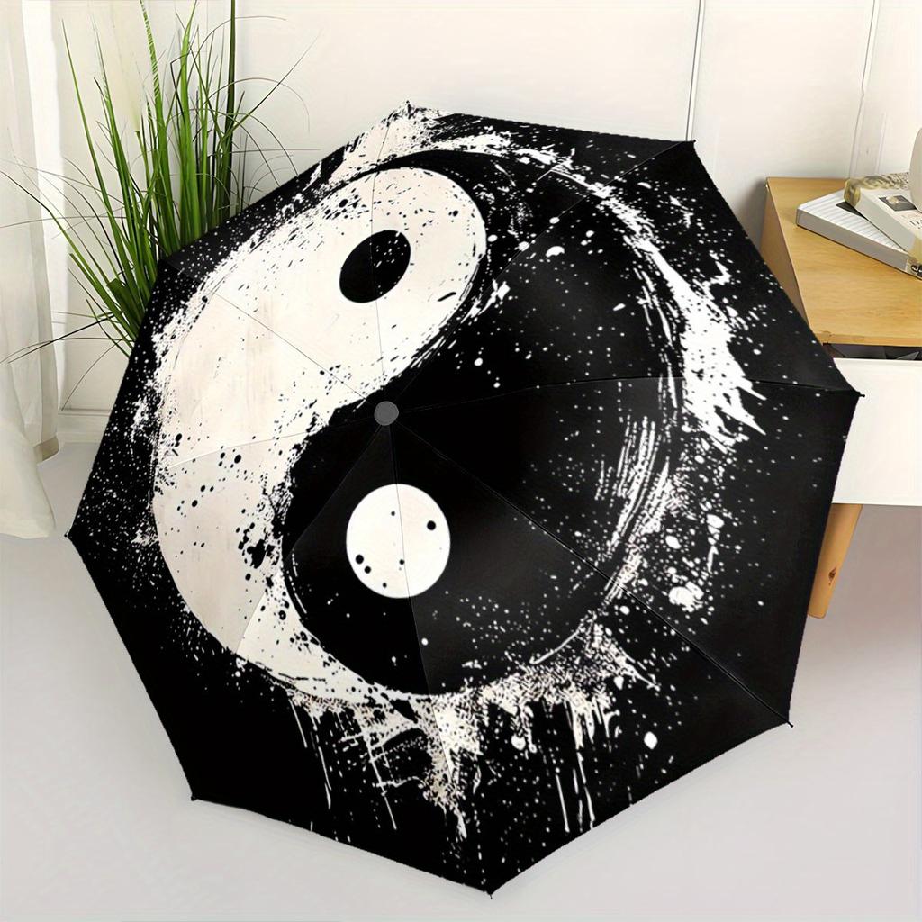 Automatic Folding Umbrella Yin-yang symbol with paint splatter effect. Portable collapsible design, casual outdoor accessory,