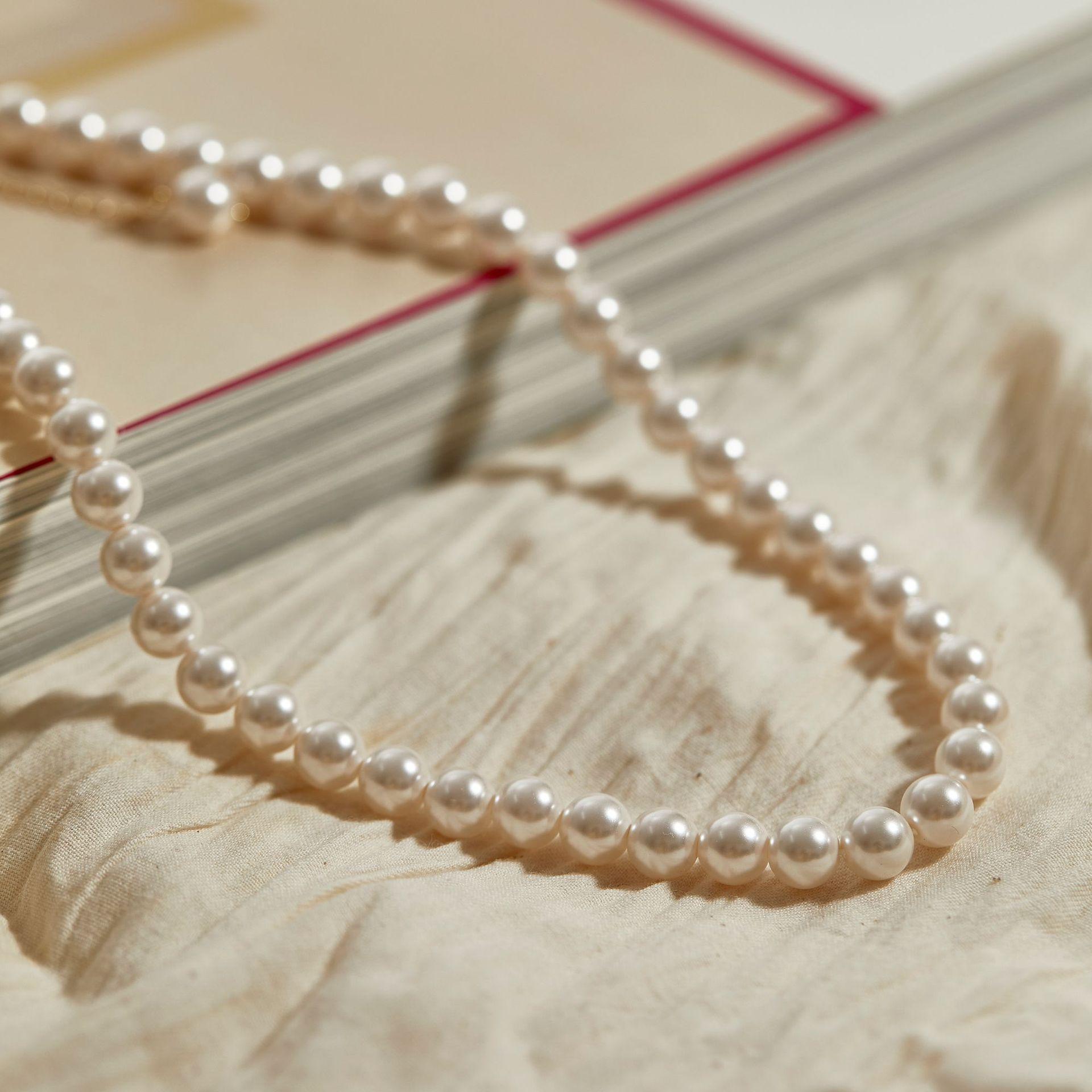 

Классическое детское жемчужное ожерелье Шицзя Идеальный круг Сильный свет Маленькие размеры Больше размеров Ультратонкое ретро-сумка из 18-каратного золота 8mm For Piece