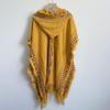 Ethnic Style Hooded Tassel Shawl Cloak – Women's Warm Knitted Cape, 2025 Collection.