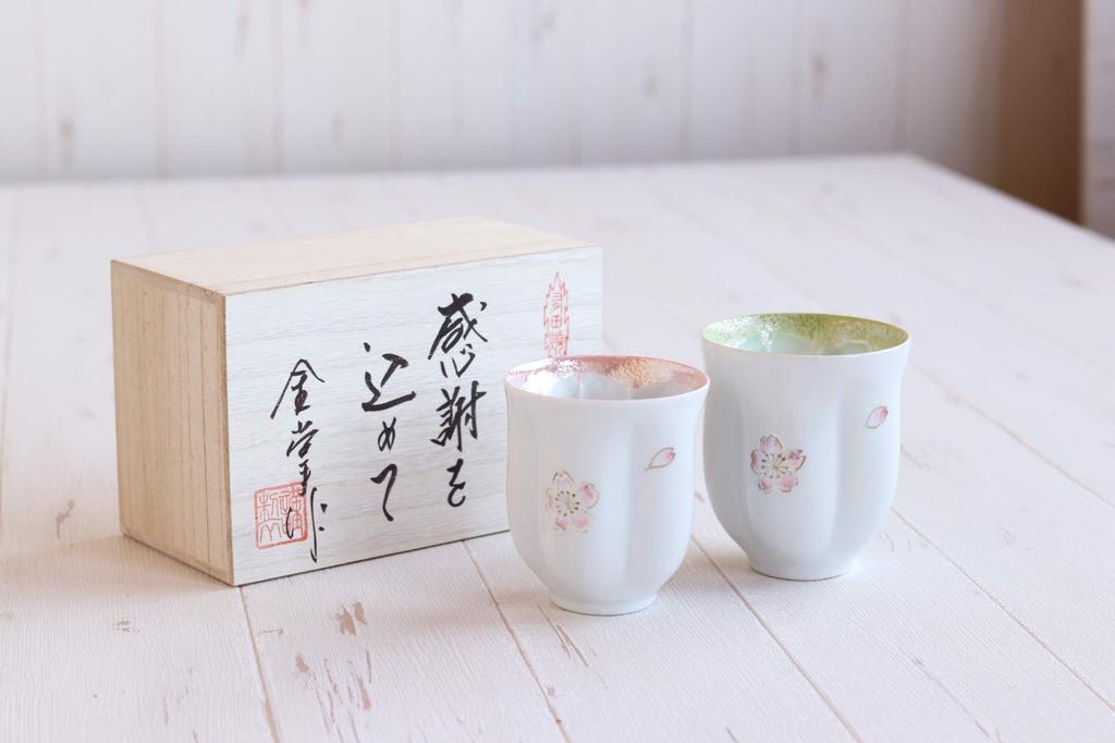 A perfect retirement gift for A pair of teacups with a floating cherry blossom Made in these Arita ware teacups make a perfect couples. design. Japan,
