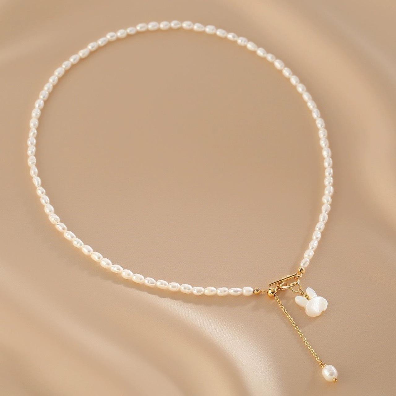 

Rice Grain Freshwater Pearl Necklace Female Shell Engraved Rabbit Pendant Temperament Fashionable Millet Bead Collarbone Chain Neck Chain