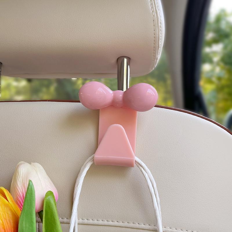 Крючок на спинку автомобильного сиденья с бантом, крючок для хранения, модный многофункциональный крючок для мелочей на спинку, аксессуары для интерьера розовый