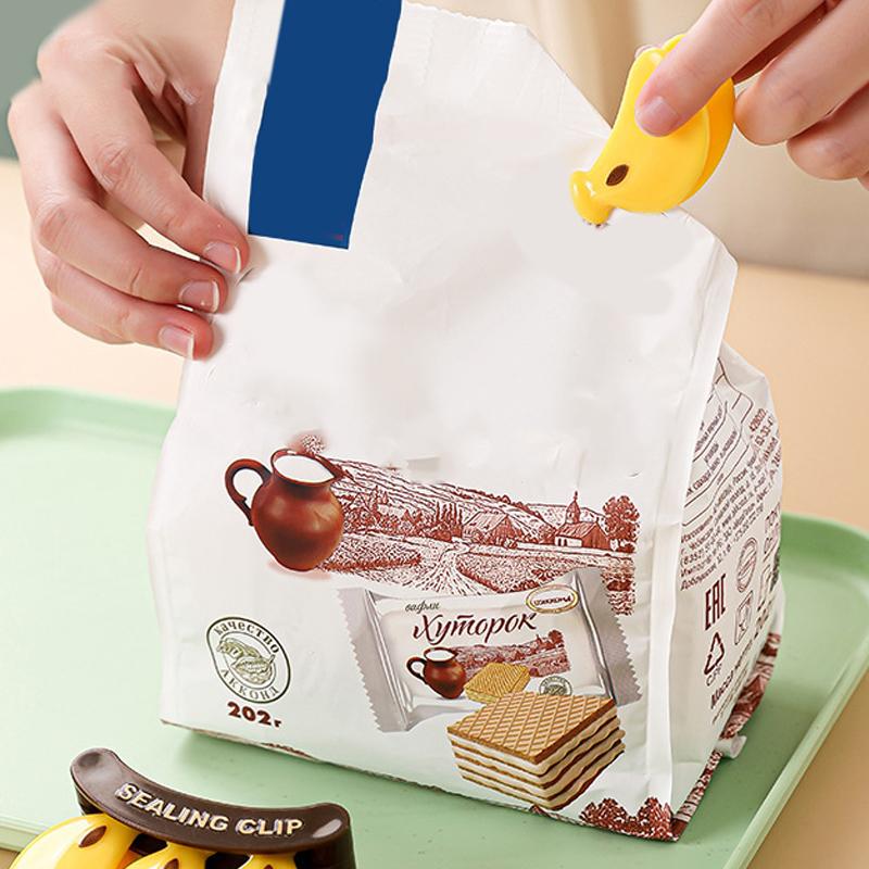 Kunststoff Bananen Magnetverschluss Feuchtigkeitsdicht Handpresse Frischhalteclip Multifunktionaler Haushalts-Lebensmittelbeutelclip