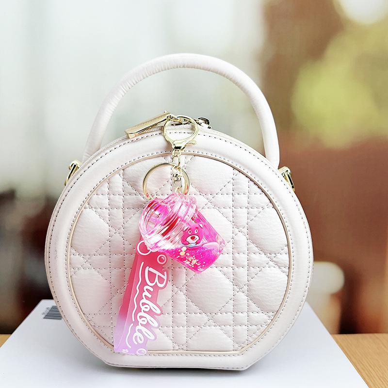 Strawberry Bear Doll Keychain with Colorful Oil-Filled Bottle and Milk Tea Cup Pendant
