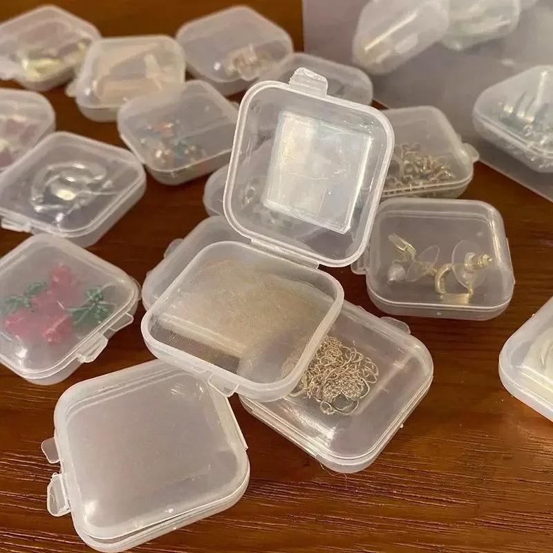 Großhandel Mini Square Aufbewahrungsbox Transparent Kunststoff Flip Cover Kleine Fall Pille Schmuck Ohrringe Staubdichte Aufbewahrung Pack Boxen