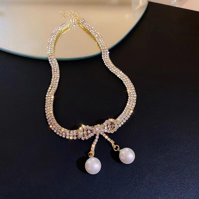 

Ожерелье из жемчуга с бантом Женское летнее легкое роскошное нишевое дизайнерское ожерелье-цепочка для ключиц Новое ожерелье от интернет-звезды золотой