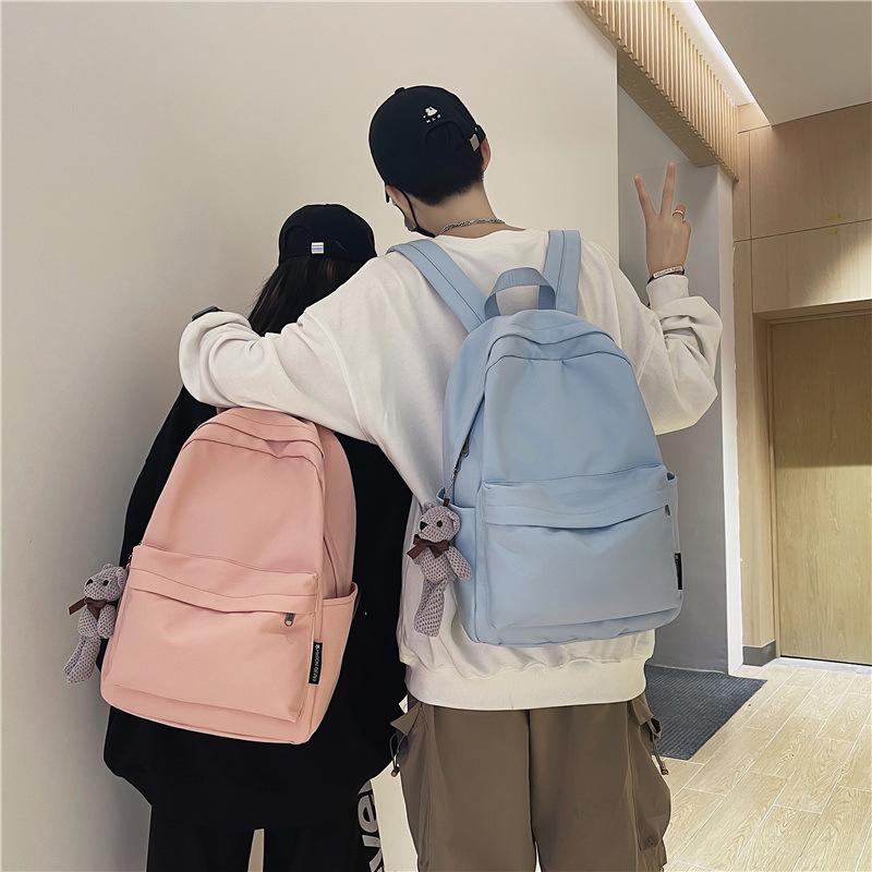 School bag female 2025 Korean version couple new large-capacity solid color versatile shoulder back trendy bag primary school students junior high sc