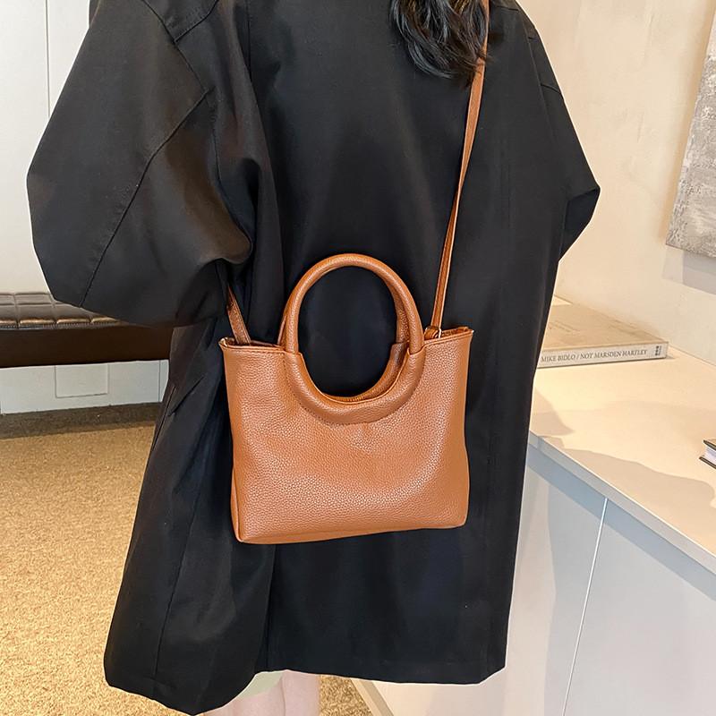 Urban Minimalist Creative Round Handheld Bag Large Capacity Tote Bag In Chic Brown Khaki White And Black Colors For Everyday Use