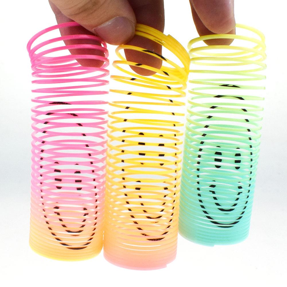 12PCS Children's Colorful Spring Ring Toys Mini Smiling Face Elastic Rainbow Ring Magic Toys Children's Birthday Party Gifts