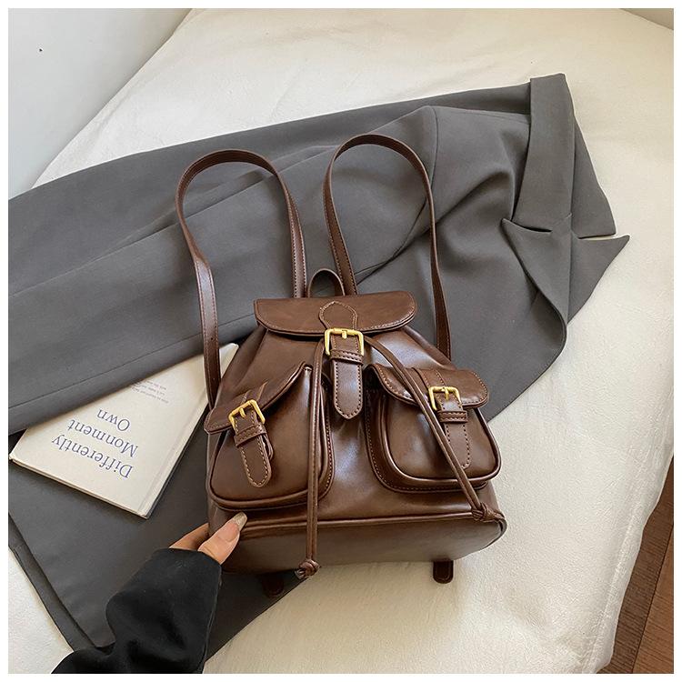 

Vintage double pocket travel backpack women 2025 new college style casual backpack fashion large capacity travel backpack светло-коричневого