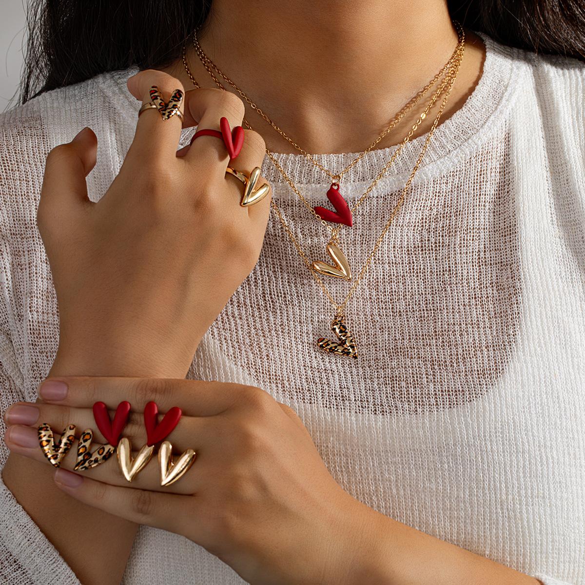 

3 pairs of earrings+3 necklaces+3 rings sexy leopard print heart-shaped red spray painted peach heart pendant jewelry set