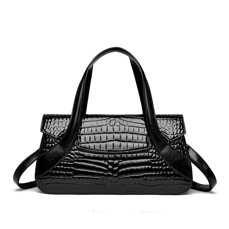 Diese Handtasche ist eine Damenhandtasche mit großem Fassungsvermögen und Krokodilmuster.. Es kann in der Hand, über der Schulter oder als Umhängetasche getragen werden.