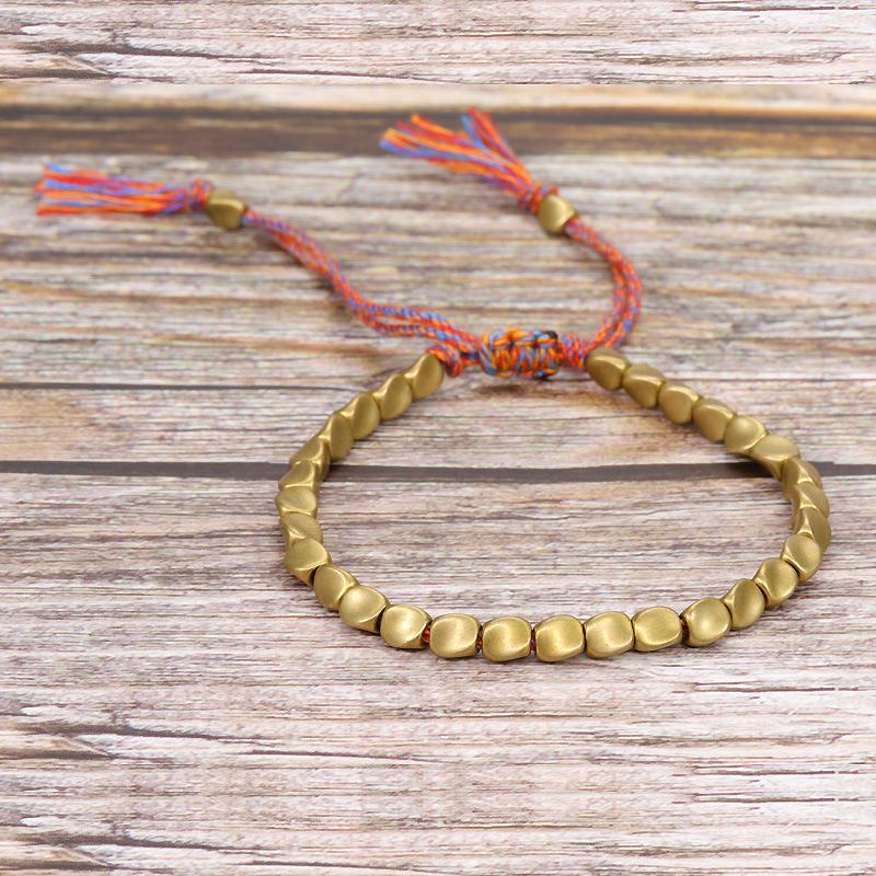Handmade Woven Bracelet with Irregular Copper Beads and Creative Tassel Drawstring