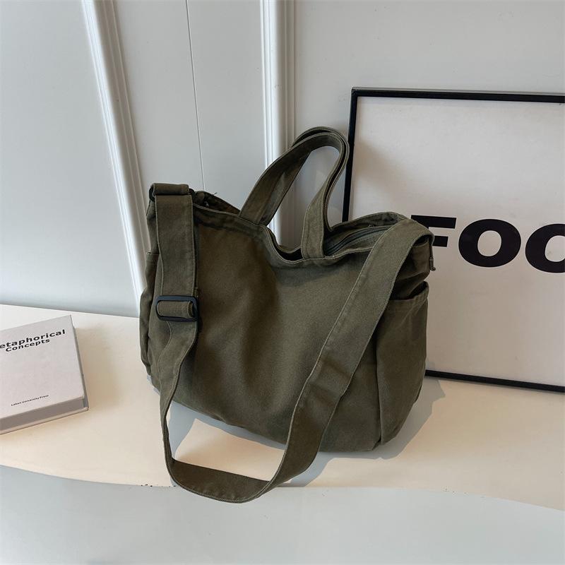 

Canvas bag female 2025 new lazy wind portable tote bag student class large capacity messenger bag female One size зелёный