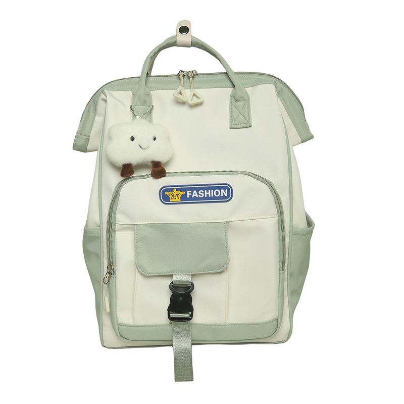 

Шкільний жіночий рюкзак контрастного кольору зелений