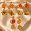 Vintage European Gold Sun Face Pendant Earrings with Amber Glass Tassel