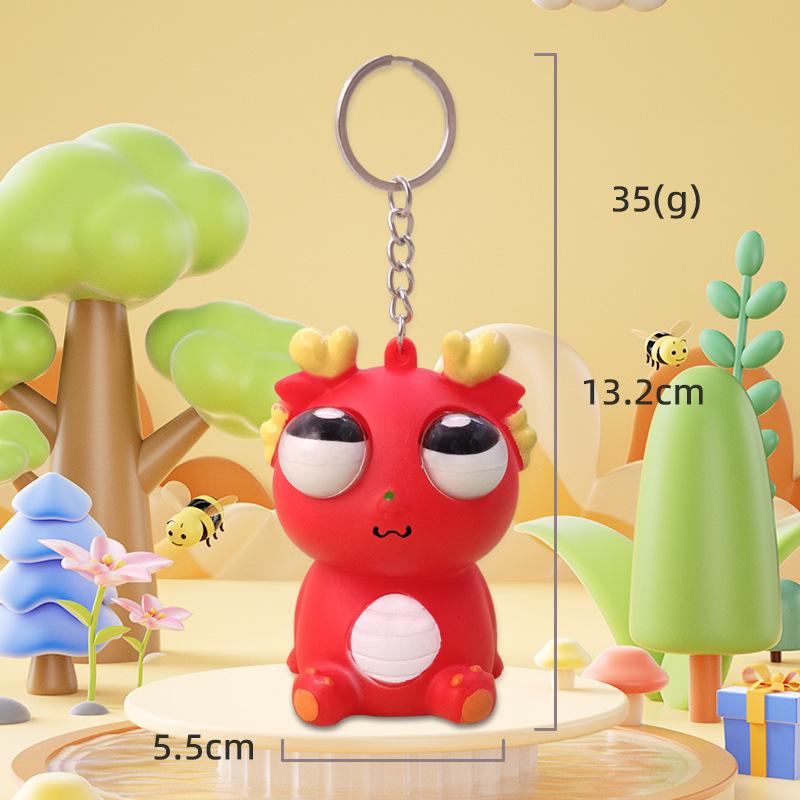 Exploding Eye Dragon Keychain: Squishy Stress Relief Toy and Pendant
