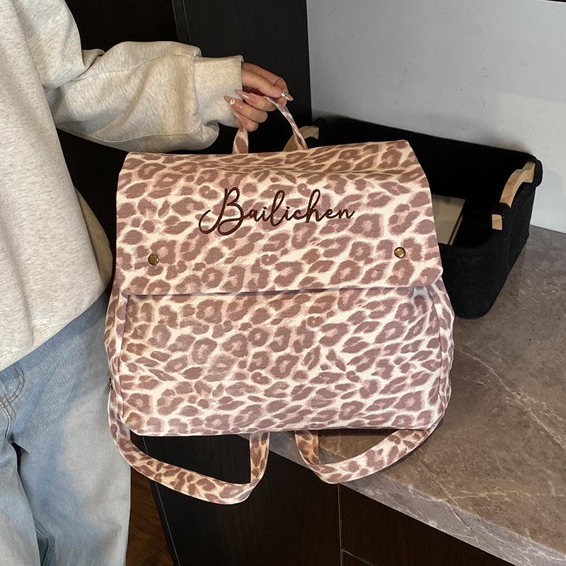 Leopard print backpack women's fashion niche design sense student class bag canvas retro tote bag travel backpack