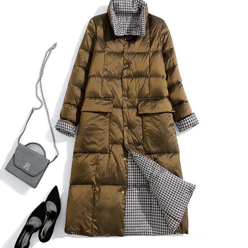 

Обе стороны Зимой женские модели средней и длинной длины свободные и тонкие, а также белые куртки на пуху длиной до колена с обеих сторон с большими карманами. XXXL золотой