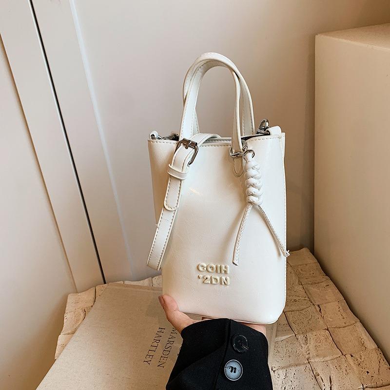 

Niche high-end hand carry leopard print bucket bag women s autumn and winter new retro fashion shoulder bag белый