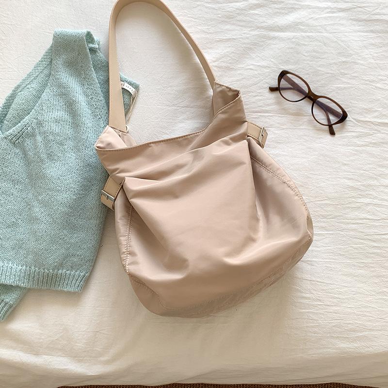 

Versatile and High-end One Shoulder Underarm Bag with Large Capacity, Women s Niche Design, Nylon Bucket Bag абрикосовий