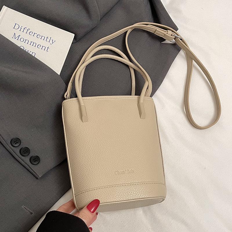 

This year s popular niche simple dopamine lychee pattern portable bucket bag women s versatile casual messenger mobile phone bag