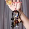 Yi Ming Xian Yuan Seed Shell Rattle Pendant: Handmade Wind Chime Bell Ornament for Backpack or Car