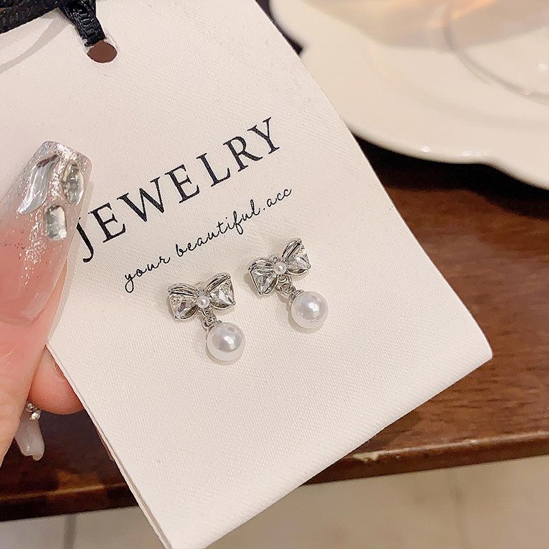 Silver Needle Bow Pearl Stud Earrings Women's Light Luxury Temperament High-end Earrings Annual Explosion Unique Earrings