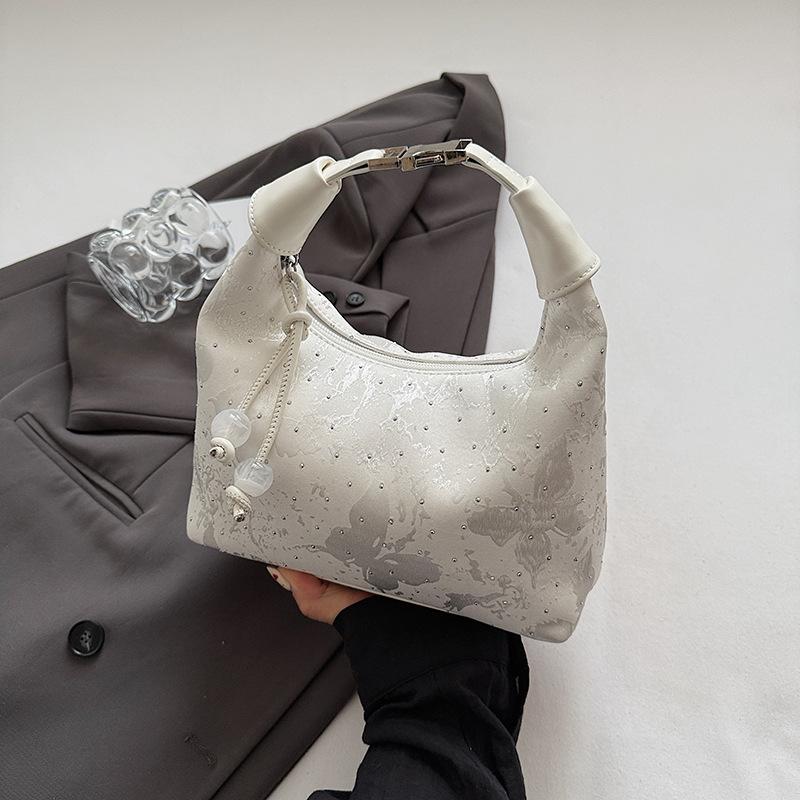 Handheld shoulder bag women's spring and summer new dumpling bag high-end commuter messenger bag