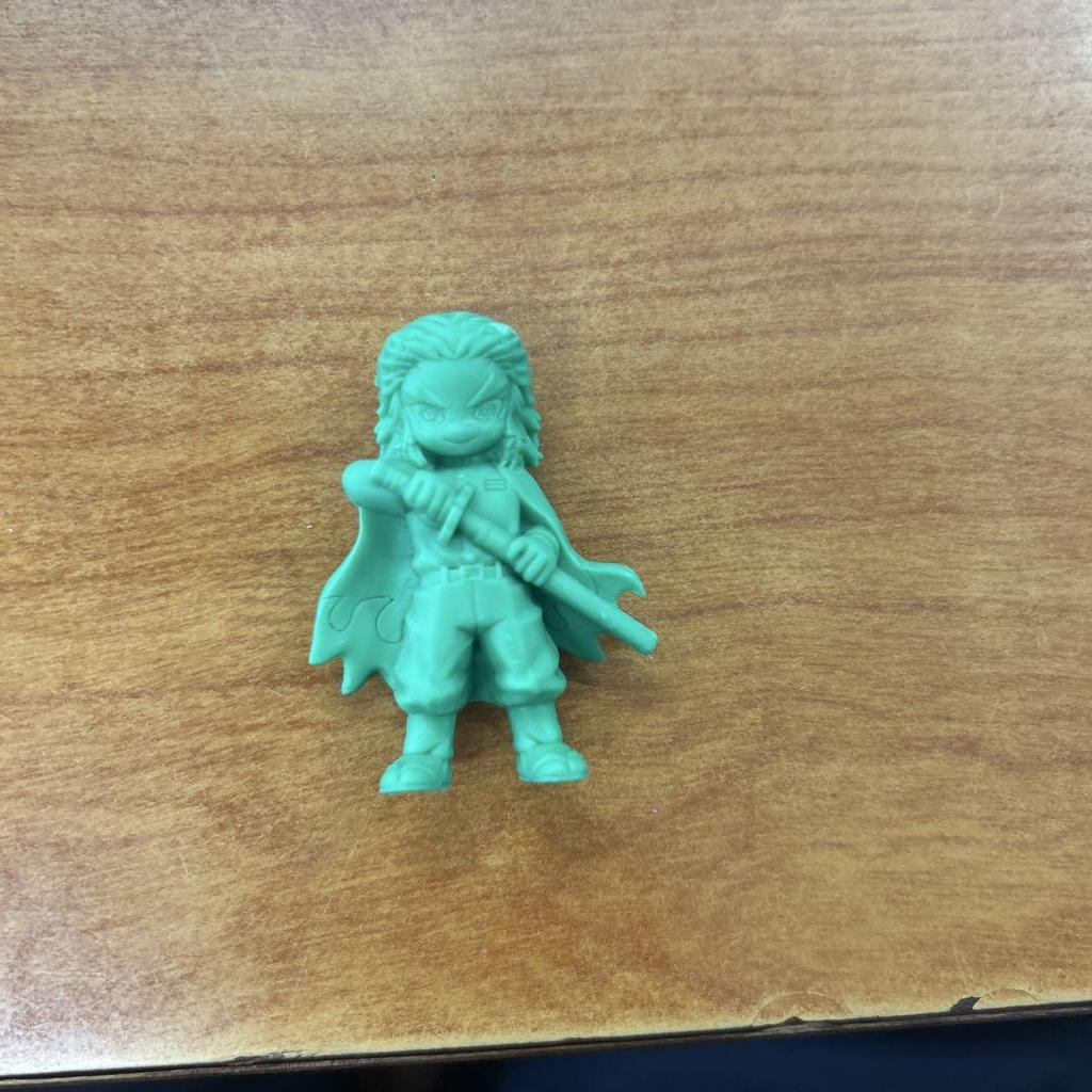 [USED] A small figurine with a green sword