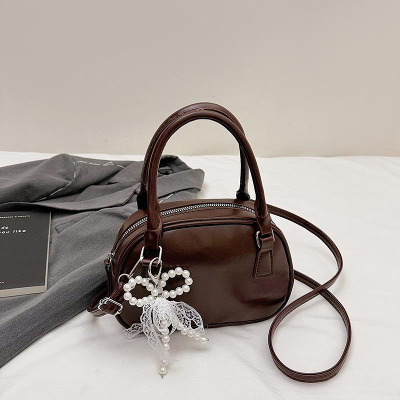 Neue Nischendesign modische Textur Handtasche Bowlingtasche Damen vielseitige Schulter Umhängetasche