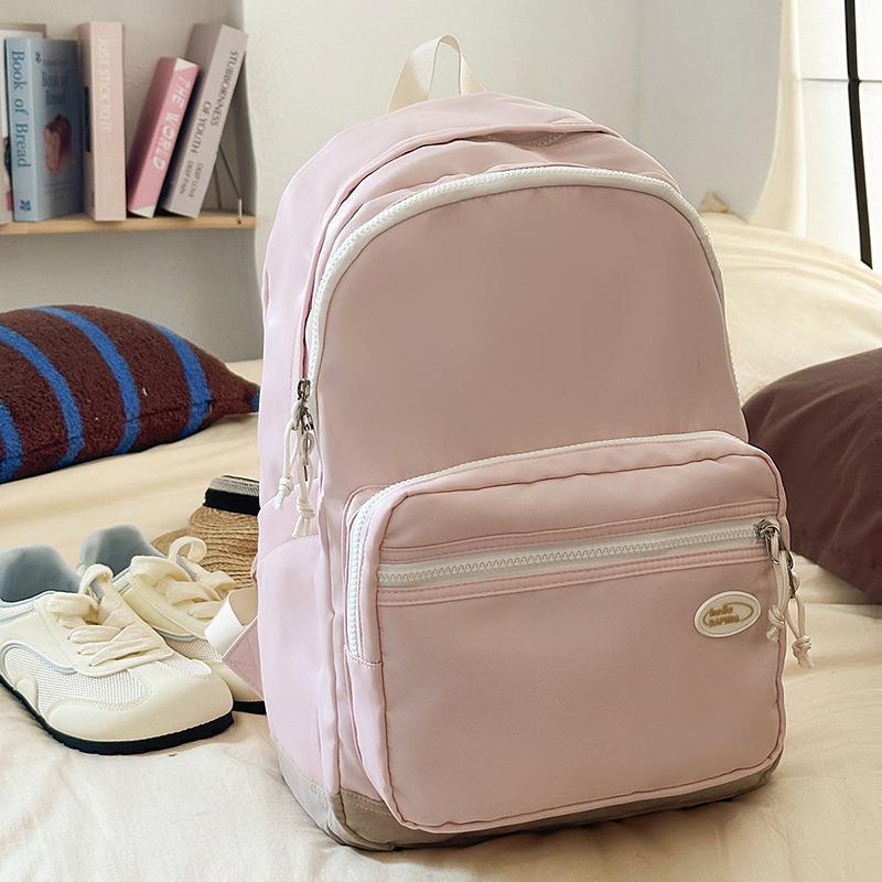 

Casual solid color men s and women s backpacks New travel lightweight computer backpacks High school schoolbags Junior high school розовый