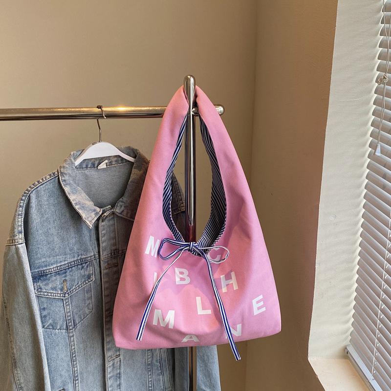 Large capacity double-sided canvas bag women's 2025 new color letter bow shoulder bag fashion student schoolbag