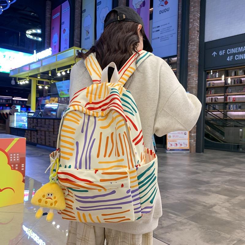 

School bag female high school college student junior high school student campus Korean version backpack versatile ins contrasting color rainbow strip single pack