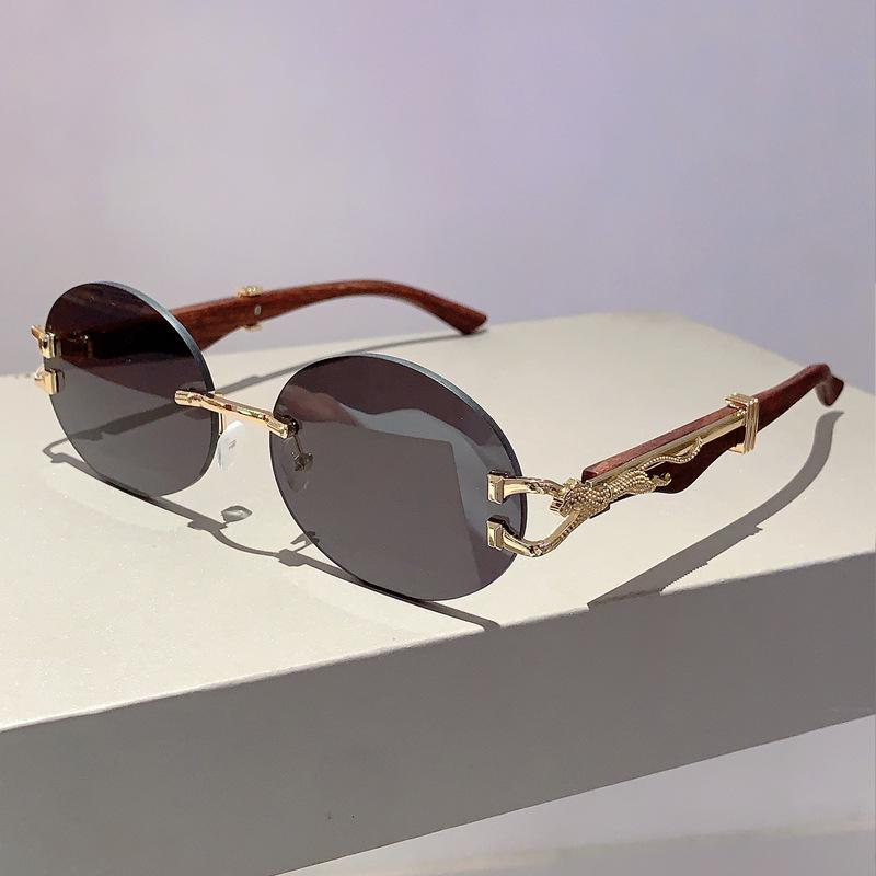 Luksusowa Marka Projektant Vintage Bezoprawkowe Owalne Okulary Przeciwsłoneczne Damskie Dla Mężczyzn Okulary Słoneczne Modne Punk Popularne Metalowe Lamparty Okulary