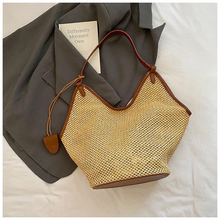 

2025 summer new woven straw bag women s fashion Korean niche shoulder bucket bag seaside beach bag