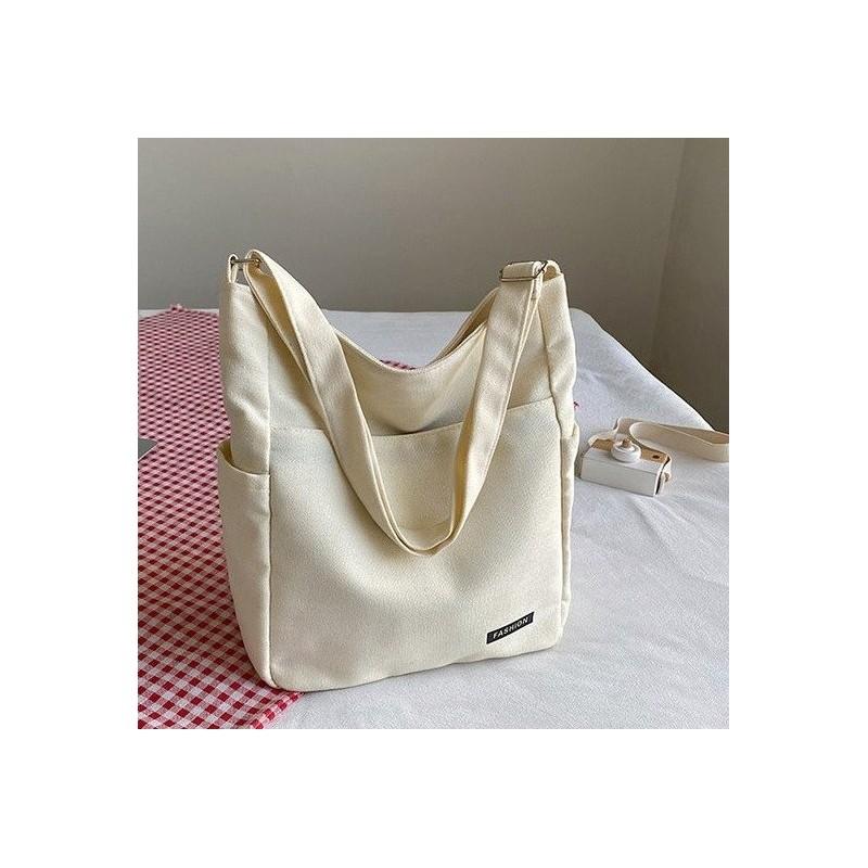 

Spacious Canvas Student Tote Bag For Casual Classes Versatile And Stylish Shoulder Bag слонова кістка