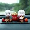 Creative Little Monk Maitreya Buddha Car Ornament: Cute, Shaking Head Resin Doll for Car Interior Decoration and Safety.