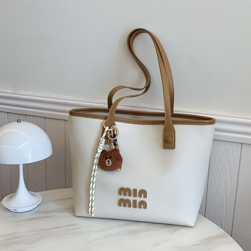 

Tote bag women s large-capacity new summer versatile casual shoulder bag textured college student commuter bag off білий колір