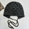 Retro twist pattern ear protection knitted hat women's autumn and winter lace-up bow wool hat warm cover cold hat