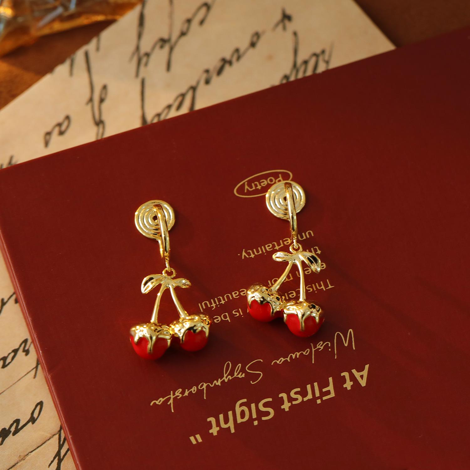 

French Retro Red Cherry Mosquito Coil Holder Festive Earrings: No-Pierce Ear Clips for Women, Comfortable New Year & Christmas Style.