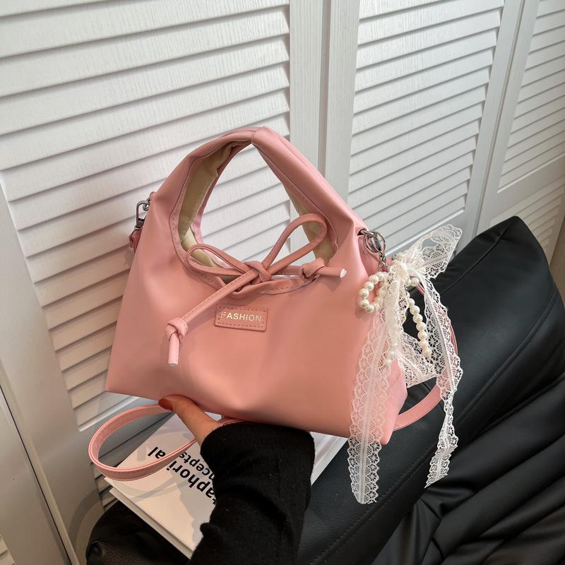 

Korean version of niche bag women s 2025 spring and summer new fashion messenger bag high-end foreign casual portable dumpling bag Single Pack розовый