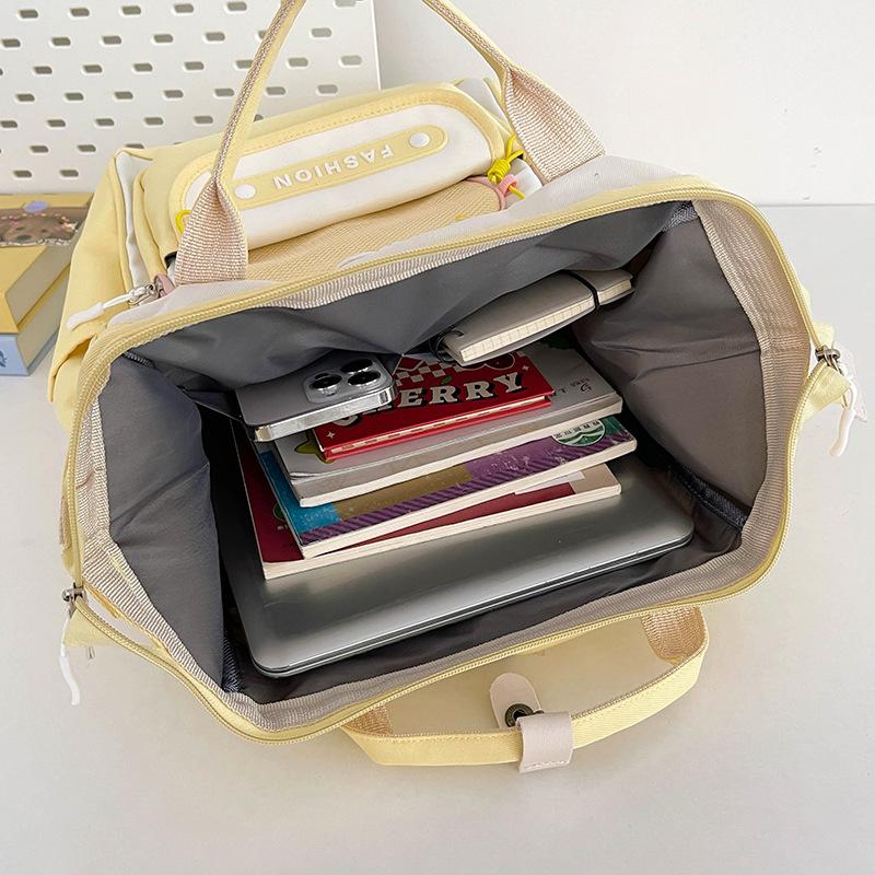 Koreanische Version von Nische Kontrastfarbe Niedlicher Rucksack für Frauen Neuer Student Große Kapazität Lässiger Rucksack Leichte Reise Doppelrucksack