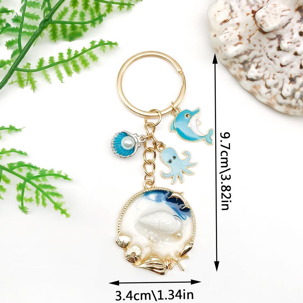 Blue Ocean Drip Oil Keychain with Dolphin, Shell, and Octopus Pendant